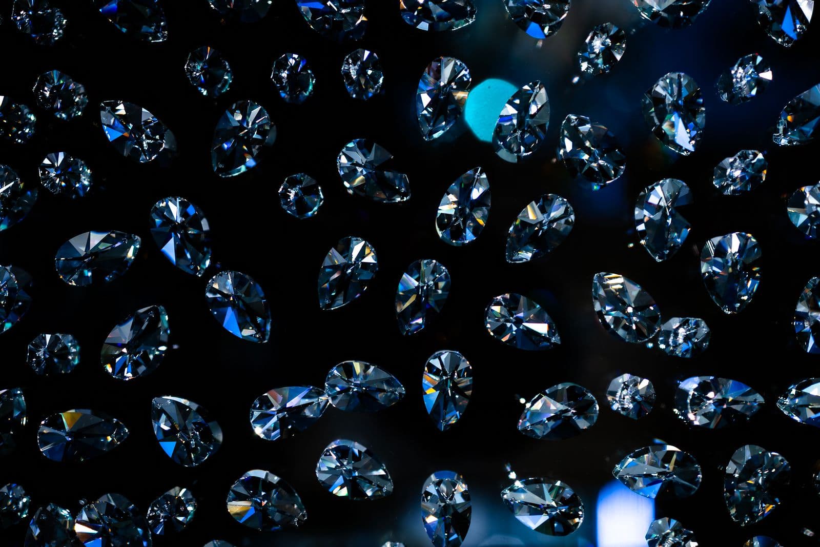 A field of lab-grown diamonds glinting against darkness